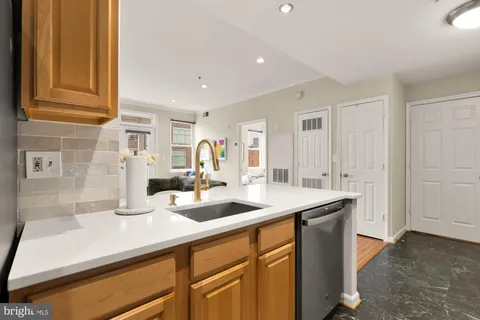 a kitchen with a sink and cabinets
