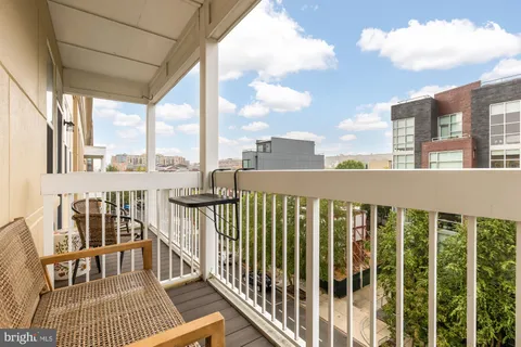 a view of a balcony with wooden floor