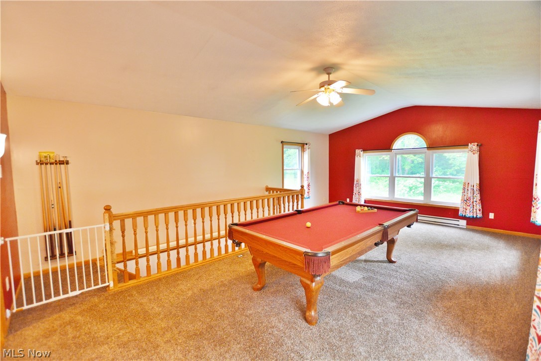7956 Sidley Road Thompson, OH 44086 - Photo 9 of 25 Recreation room featuring carpet, a baseboard heating unit, ceiling fan, pool table, and lofted ceiling
