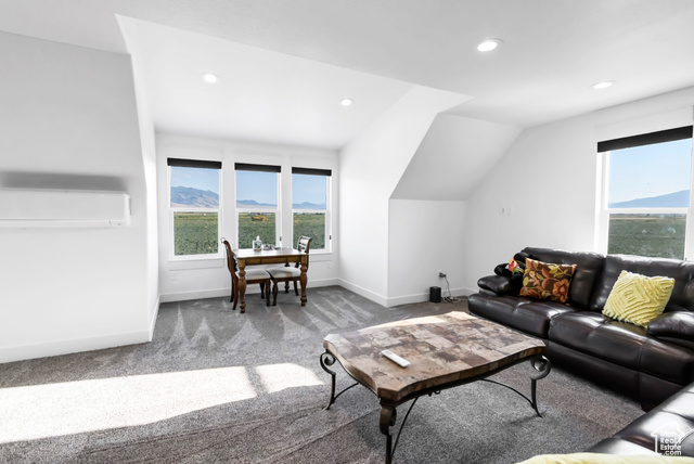 1952 Highway 118 Monroe, UT 84754 - Photo 49 of 88 Living room with a wall unit AC, carpet floors, recessed lighting, and lofted ceiling