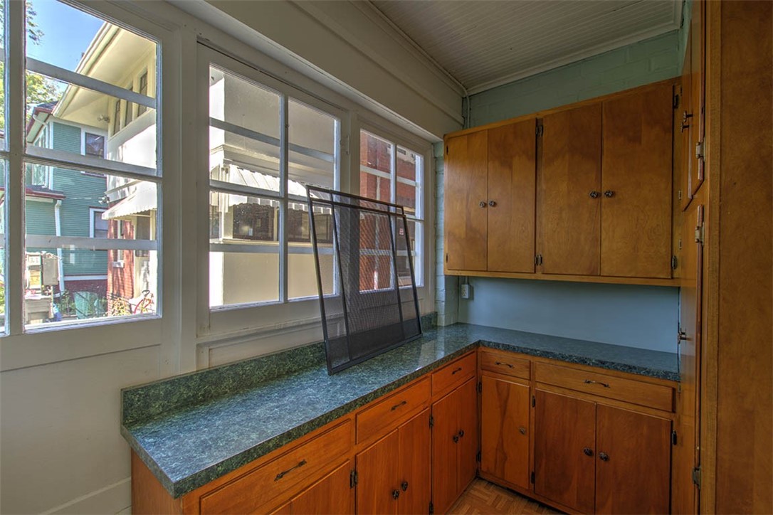 531 West William Street Decatur, IL 62522 - Photo 11 of 28 a kitchen with granite countertop wooden cabinets and a granite counter tops