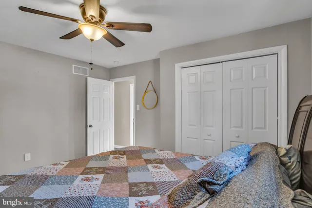 a bathroom with a sink vanity and a mirror