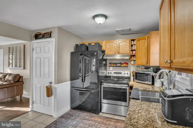 a kitchen that has a cabinets counter space and appliances