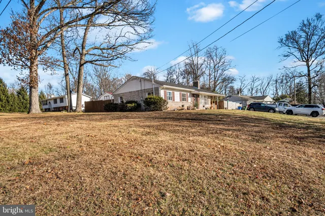 a view of a livingroom with furniture and a window