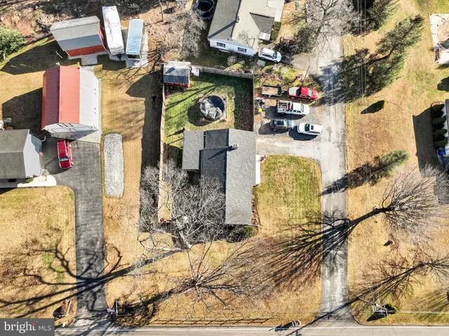 a view of a patio with a table chairs and backyard