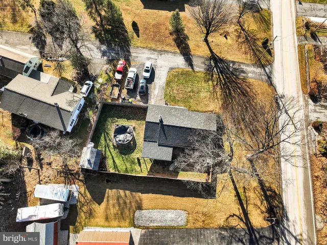 a living room with furniture a fireplace and a window