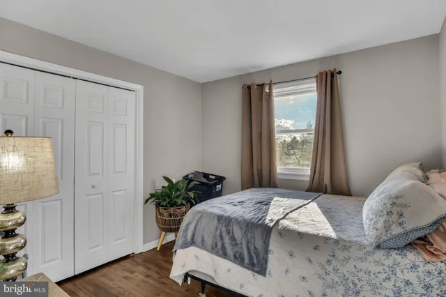 a bedroom with furniture and a window