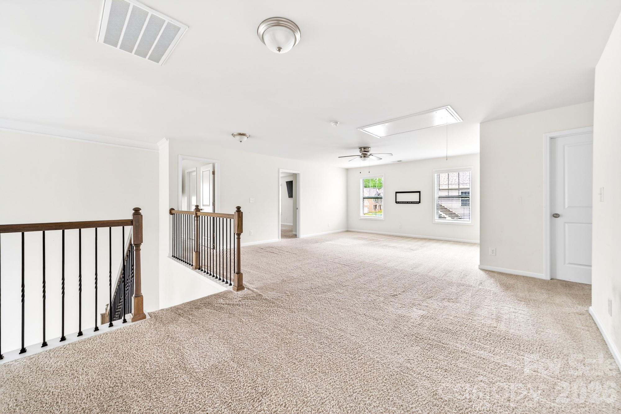 5972 Redwood Pine Road Concord, NC 28027 - Photo 20 of 37 a view of a hallway with wooden shelves