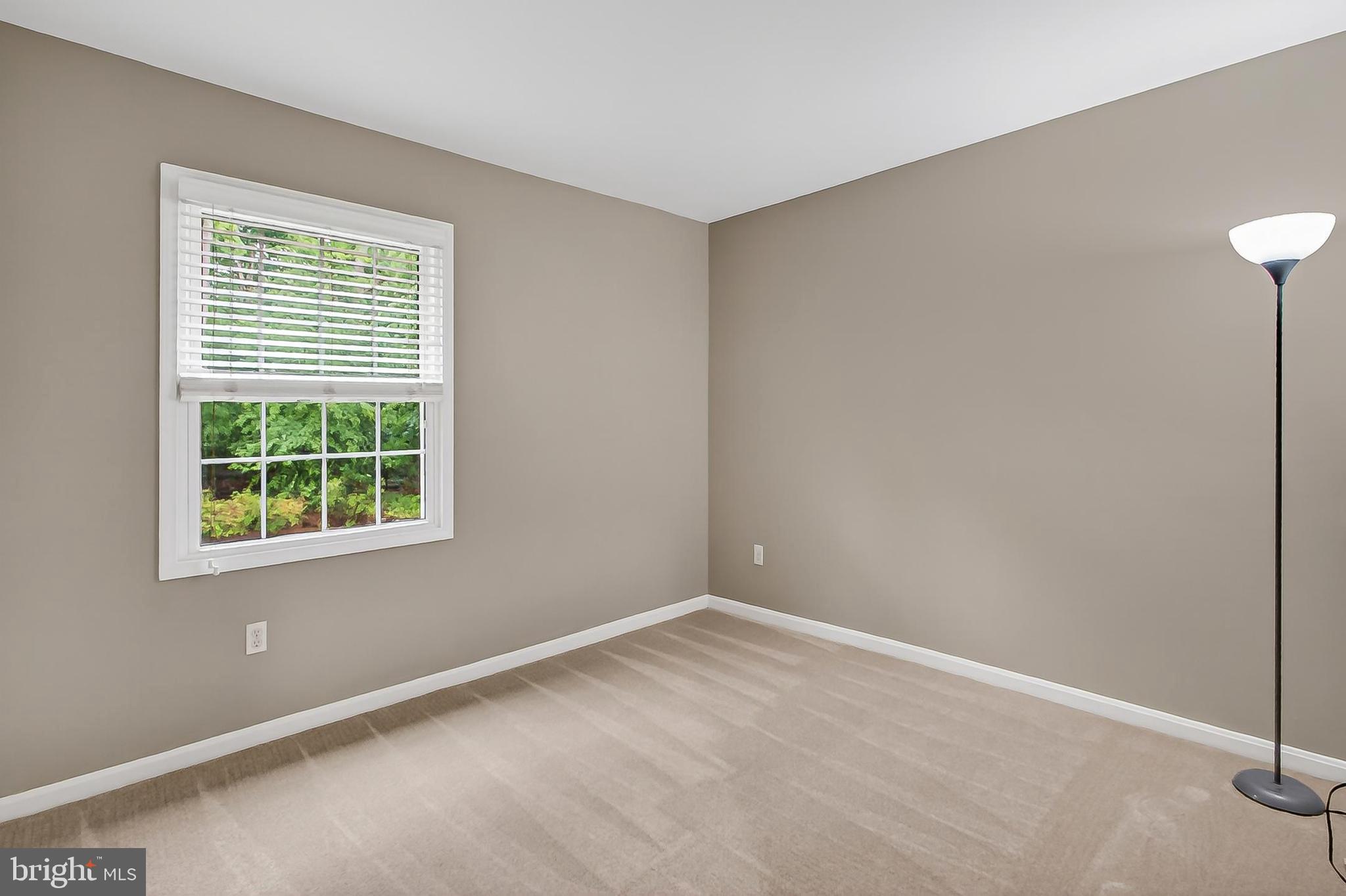 5833 Royal Ridge Drive, Unit 943 Springfield, VA 22152 - Photo 26 of 45 a view of an empty room with a window