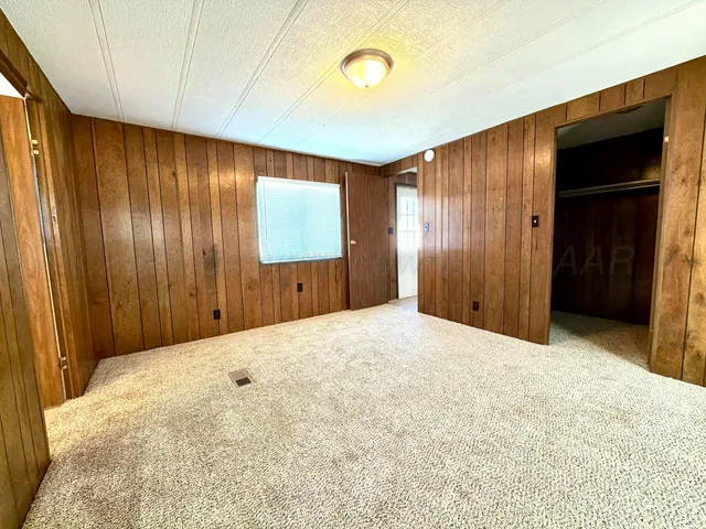 a bathroom with a tub sink and toilet