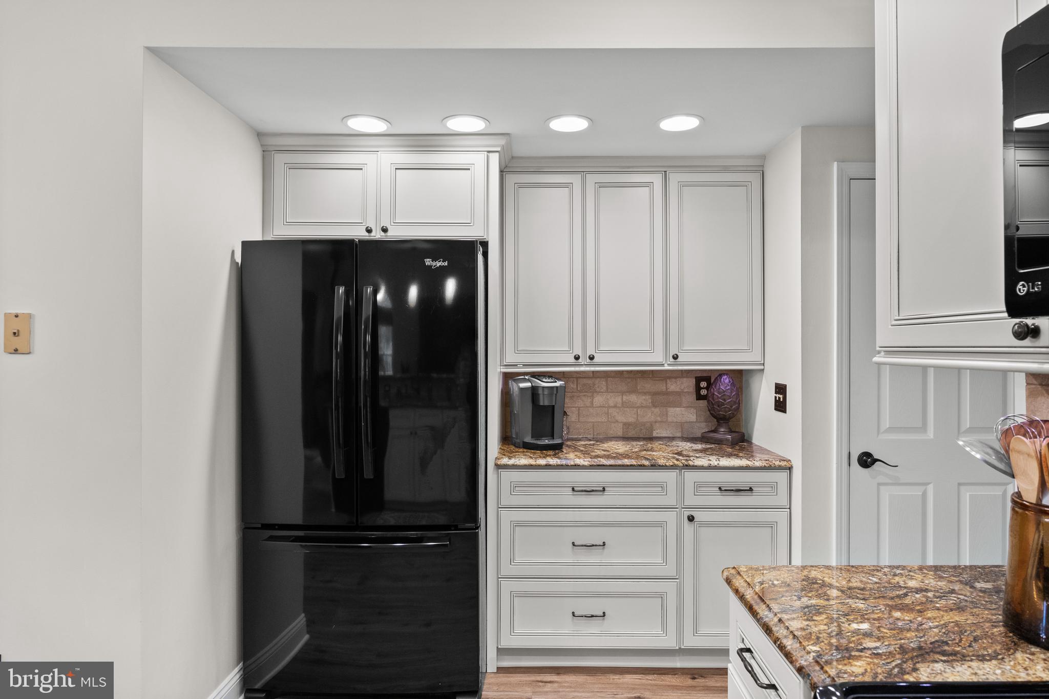 12 Springcress Drive Delran, NJ 08075 - Photo 18 of 46 a kitchen with a refrigerator and cabinets