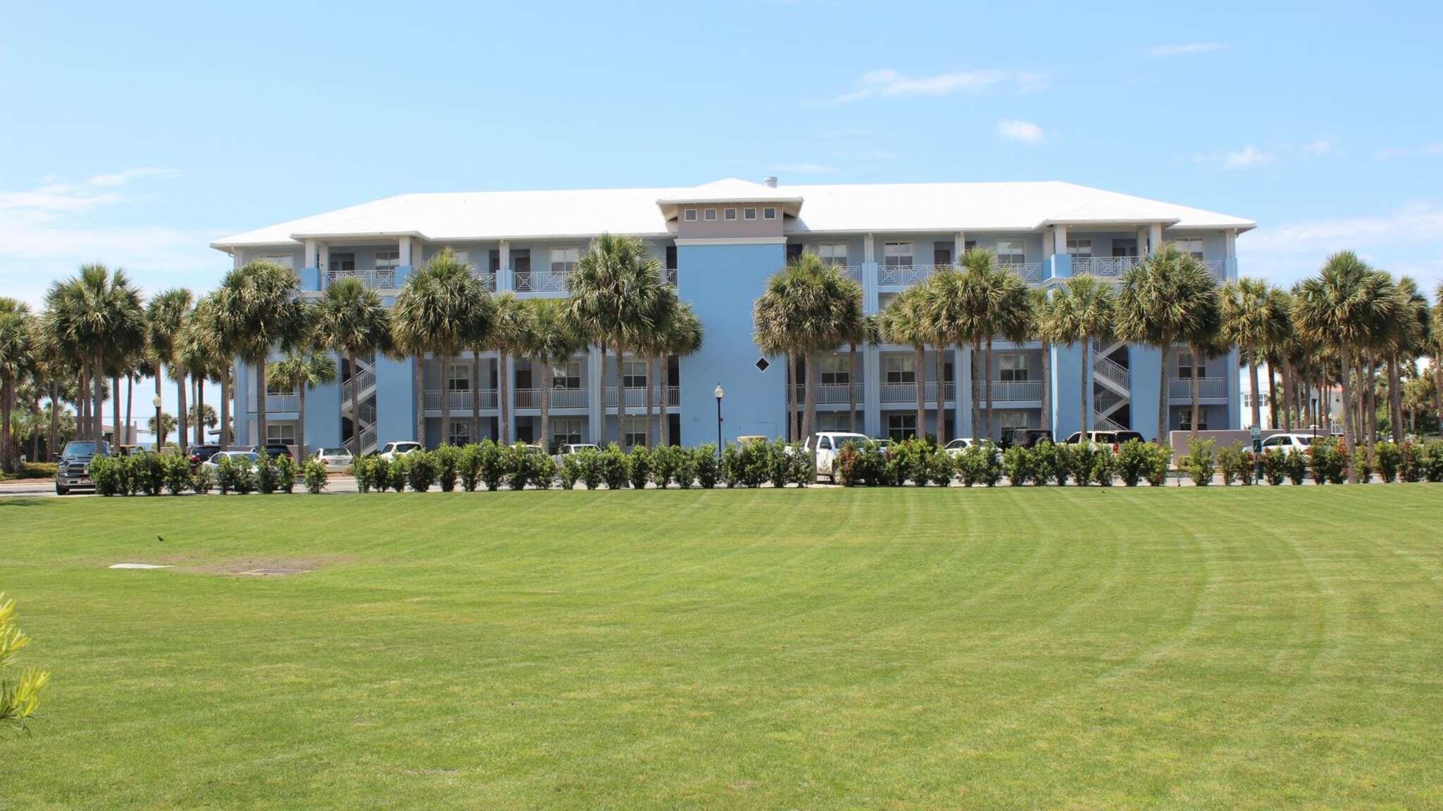 145 Spires Lane, Unit 406 Santa Rosa Beach, FL 32459 - Photo 30 of 38 a front view of a house with a garden