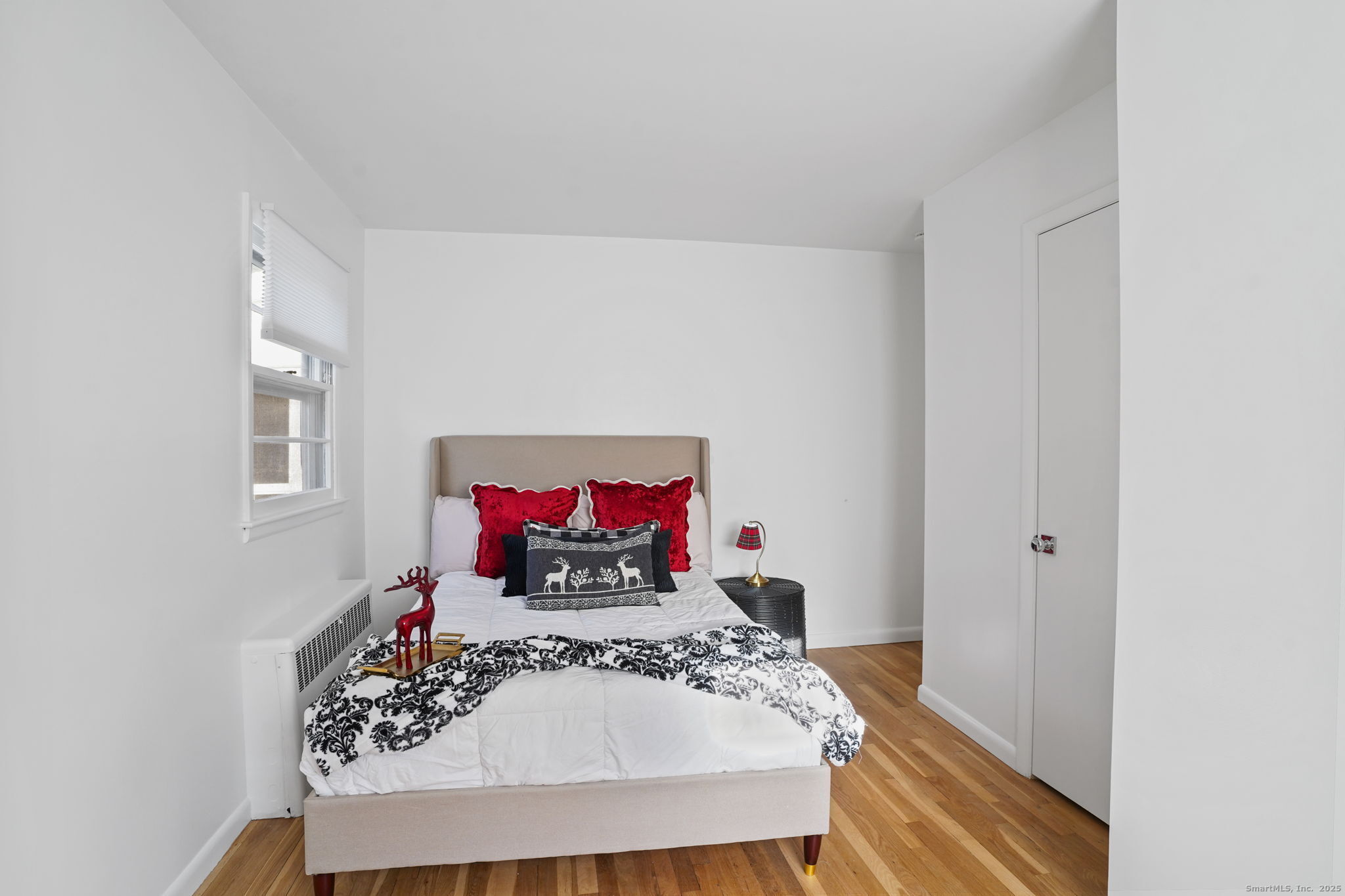 132 Toll House Lane Fairfield, CT 06825 - Photo 21 of 38 a living room with furniture and a wooden floor