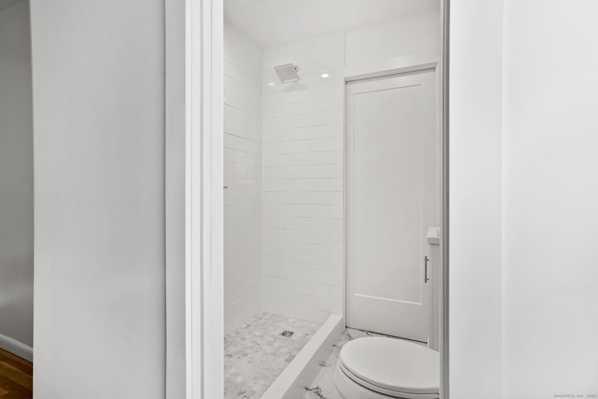 132 Toll House Lane Fairfield, CT 06825 - Photo 25 of 38 a bathroom with a granite countertop toilet and a shower