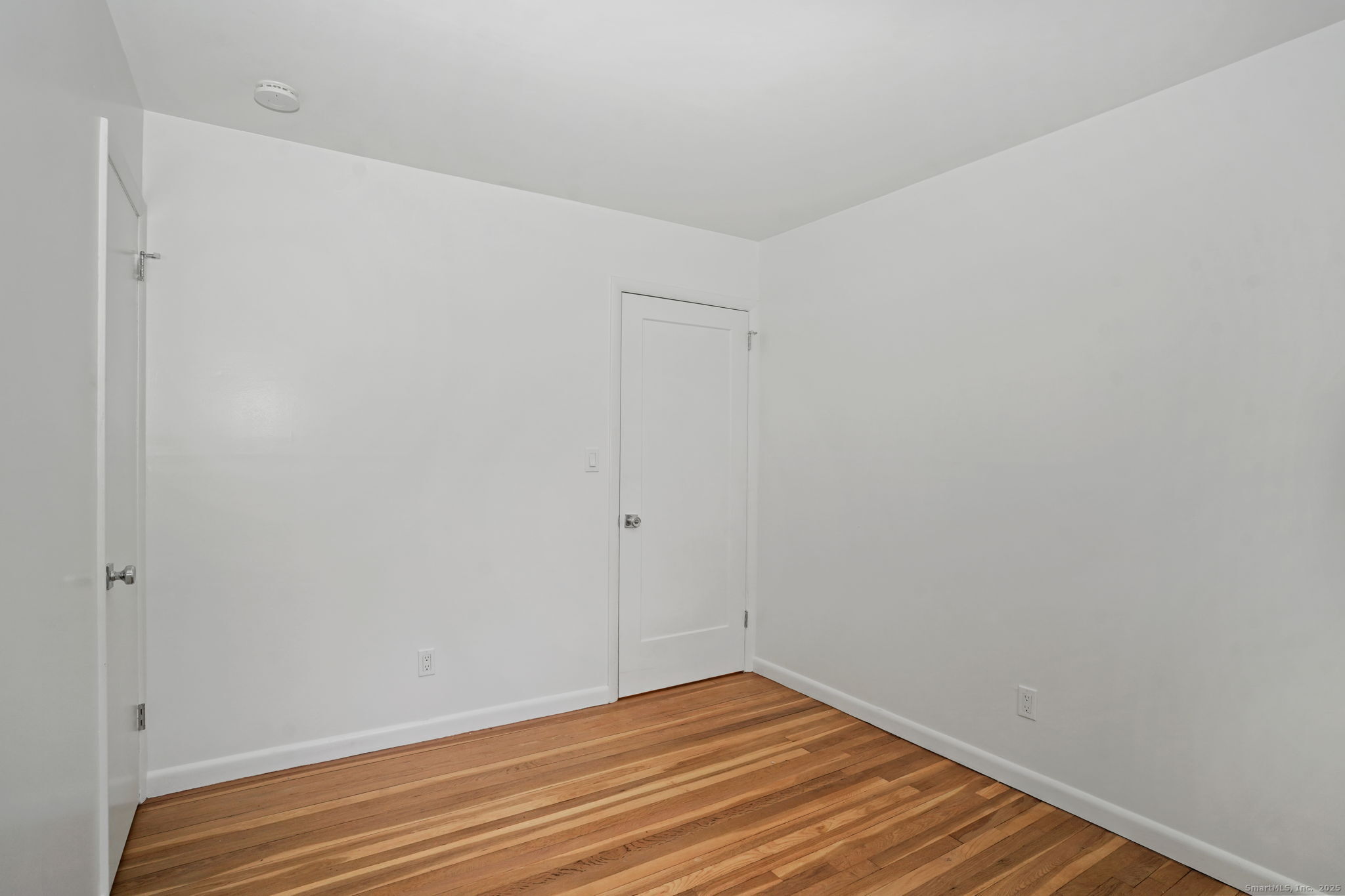 132 Toll House Lane Fairfield, CT 06825 - Photo 28 of 38 a view of room with wooden floor