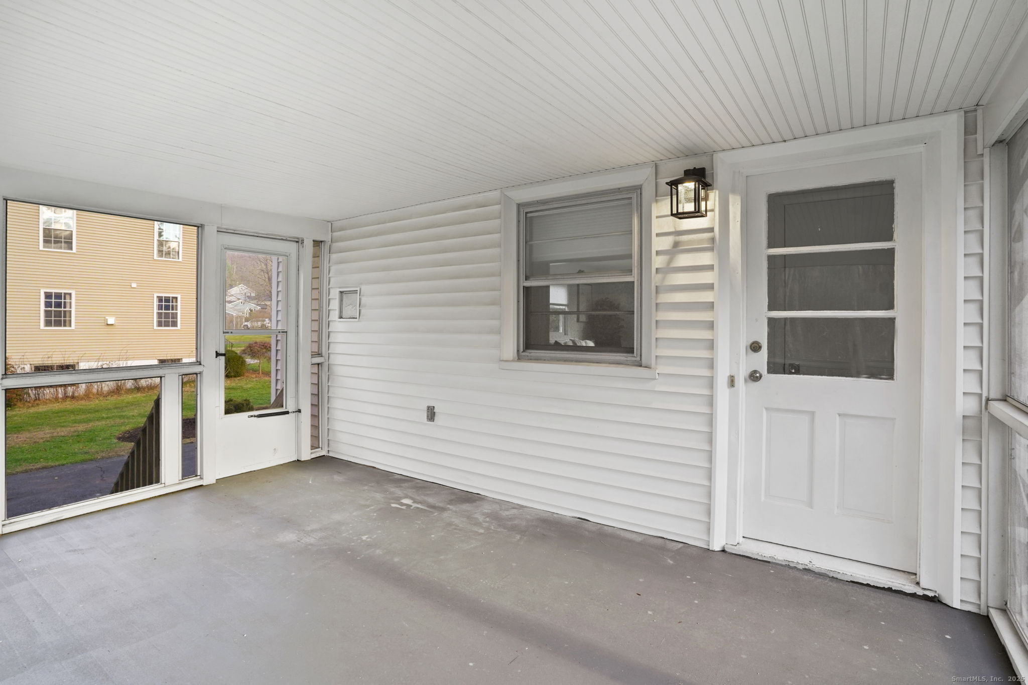 132 Toll House Lane Fairfield, CT 06825 - Photo 31 of 38 a view of an empty room with a window and fire place