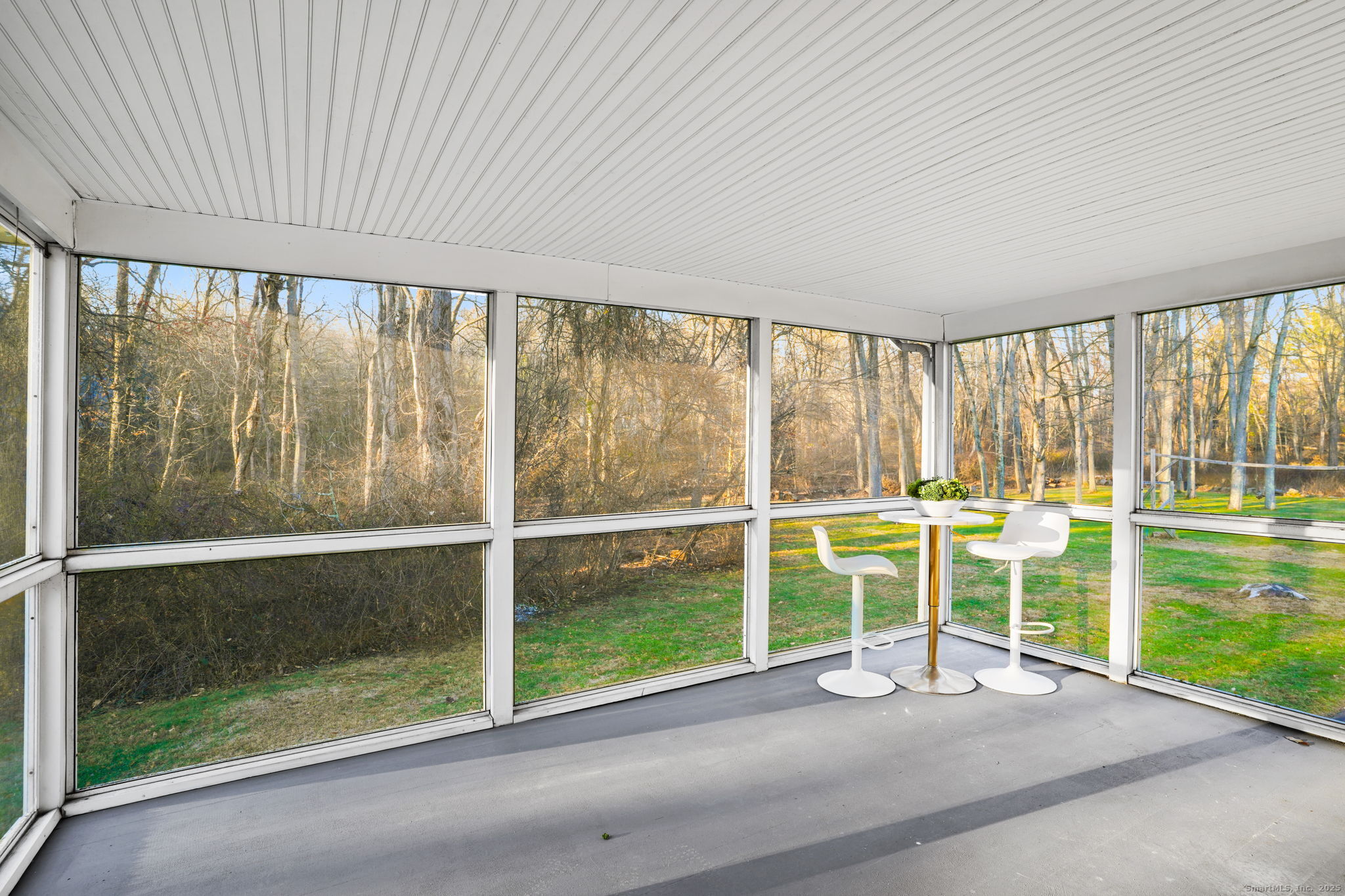 132 Toll House Lane Fairfield, CT 06825 - Photo 32 of 38 a view of an empty room with wooden floor and a window