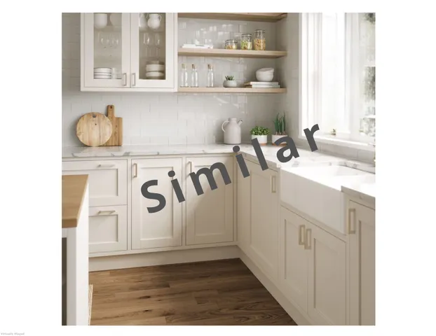 a bathroom with a sink a vanity and a window