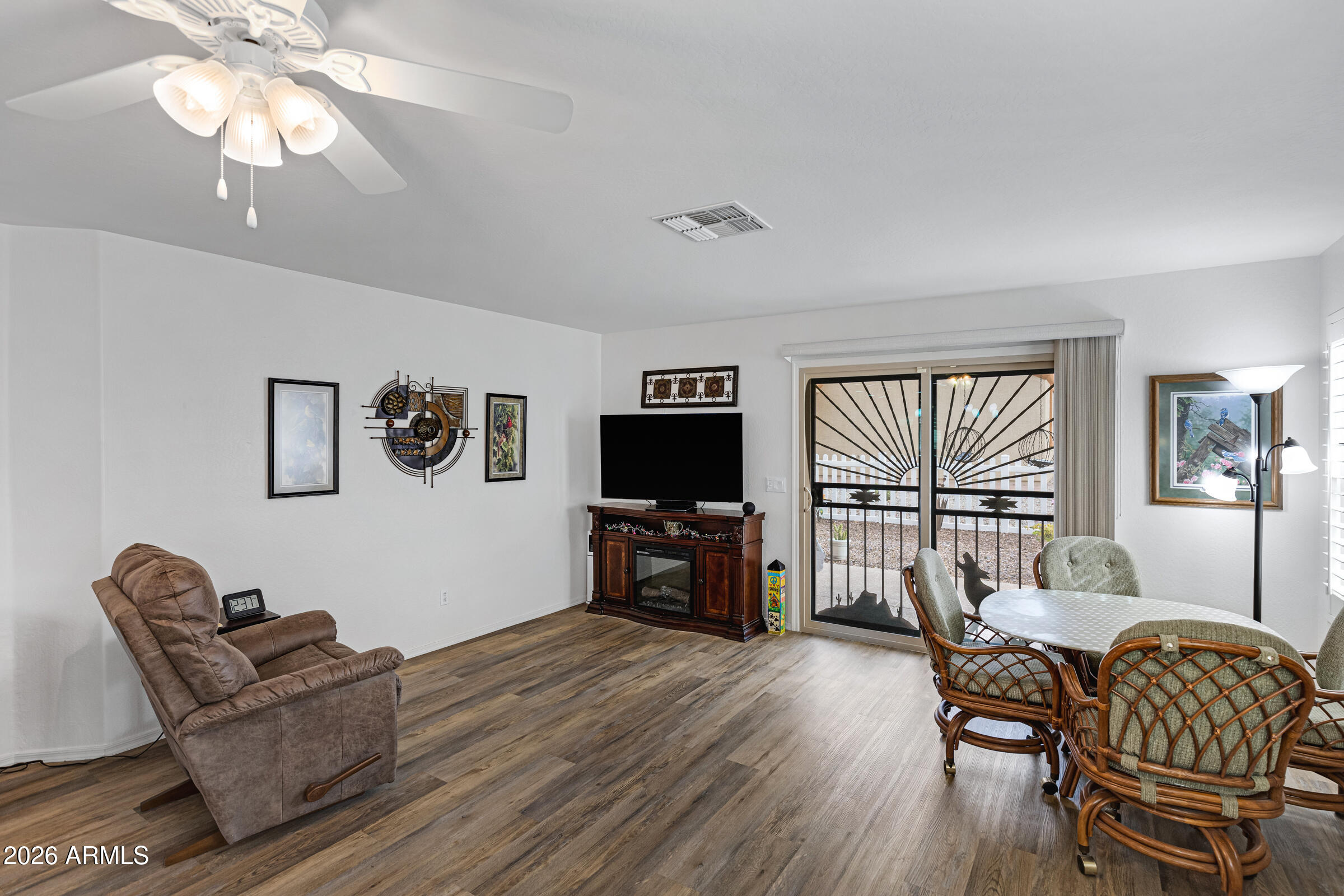 2101 South Meridian Road, Unit 199 Apache Junction, AZ 85120 - Photo 12 of 26 a living room with furniture and a flat screen tv