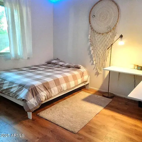 a bedroom with a bed and window