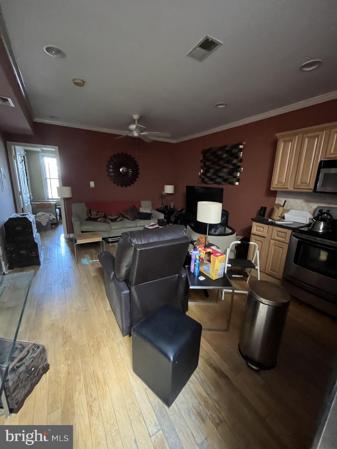 1109 Penn Street Northeast, Unit 4 Washington, DC 20002 - Photo 2 of 5 a living room with furniture and a flat screen tv