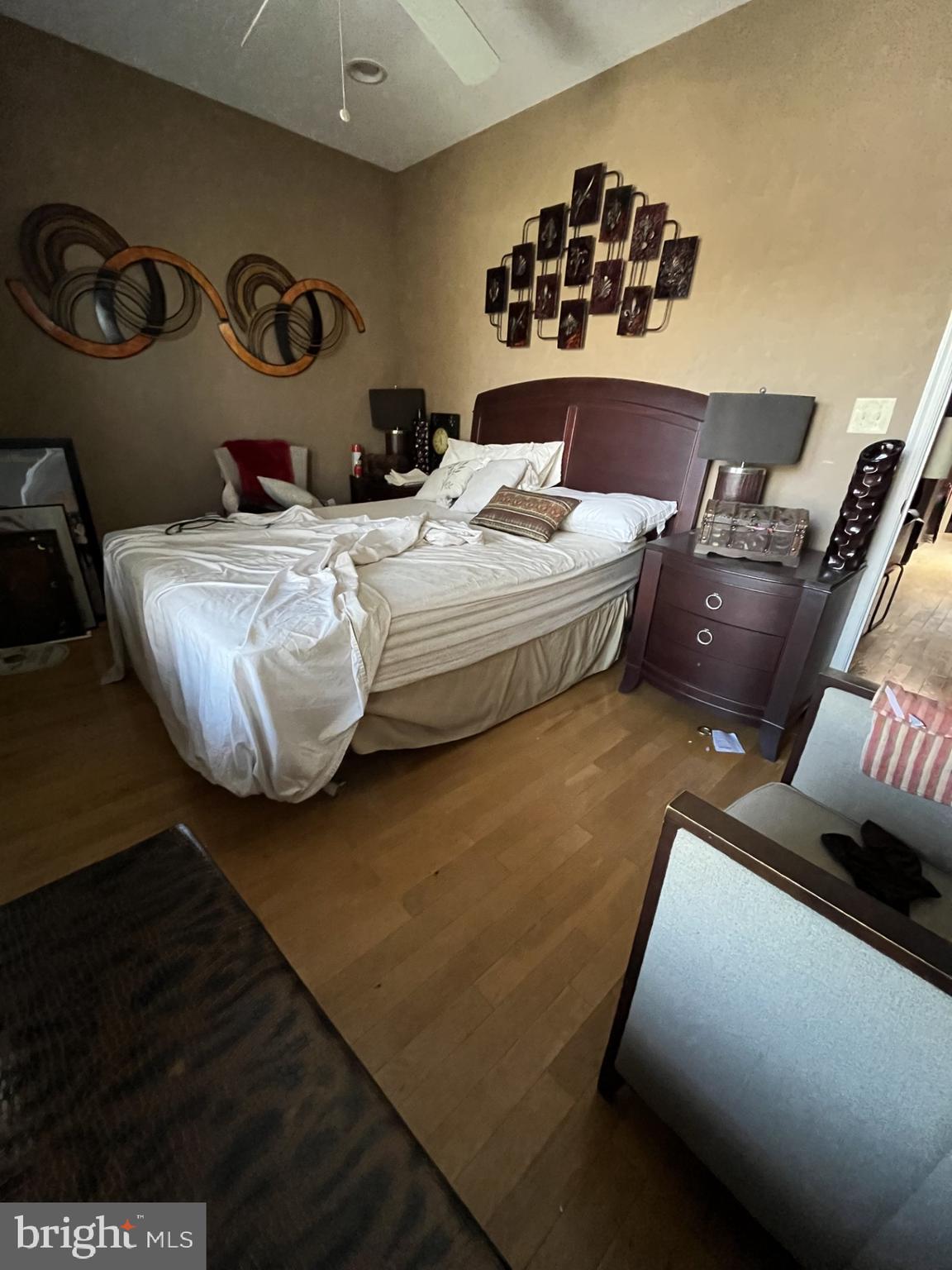 1109 Penn Street Northeast, Unit 4 Washington, DC 20002 - Photo 3 of 5 a bedroom with a bed and dresser