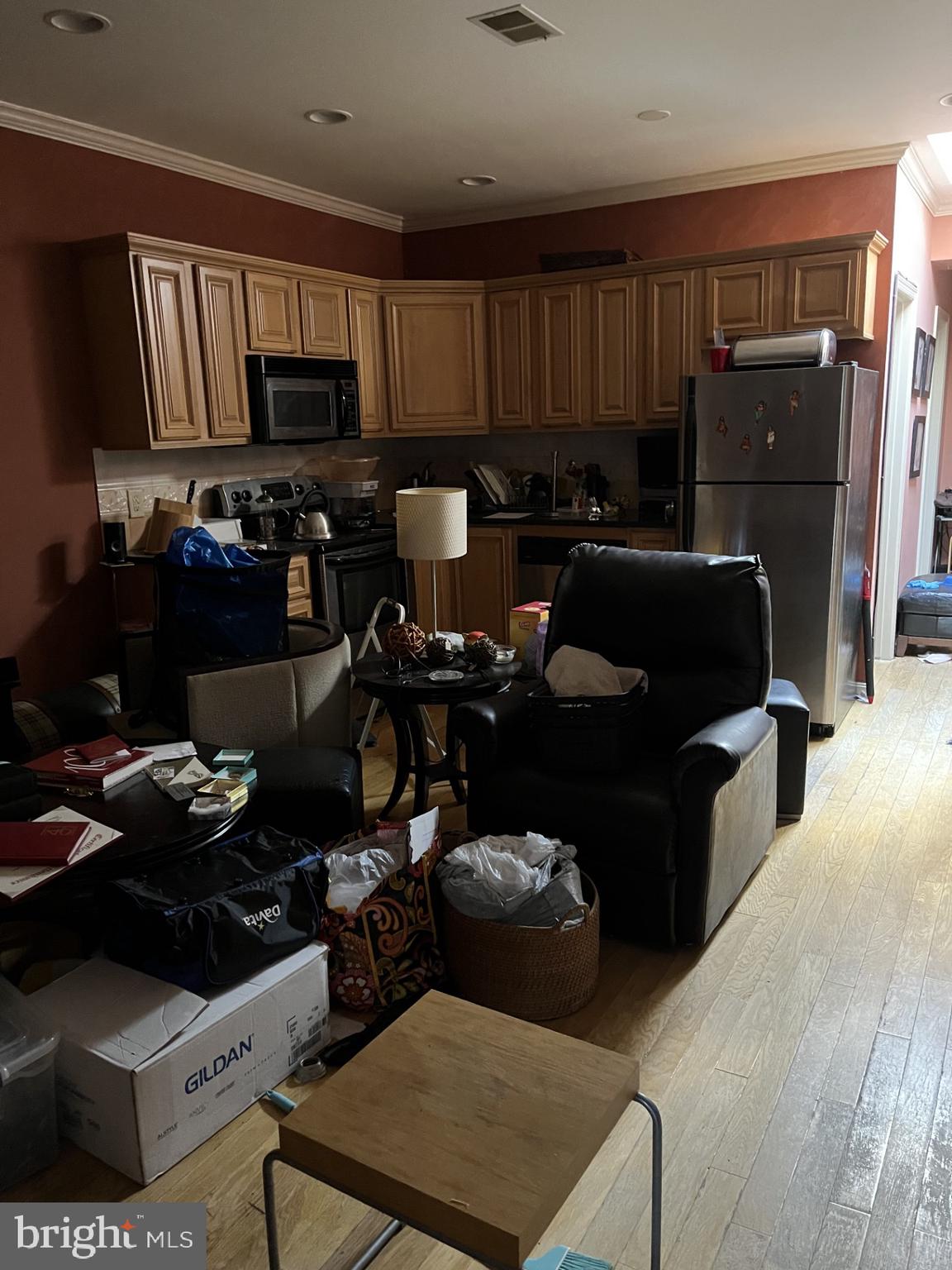 1109 Penn Street Northeast, Unit 4 Washington, DC 20002 - Photo 4 of 5 a kitchen with a refrigerator and a stove top oven