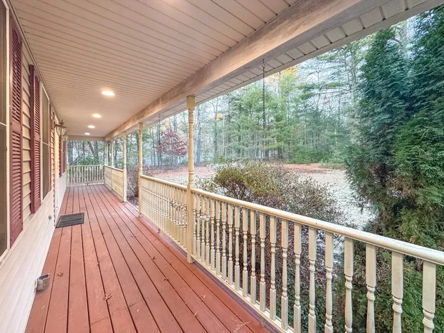 a view of balcony with wooden floor