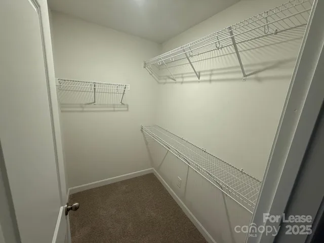 a view of a room with racks on the wall