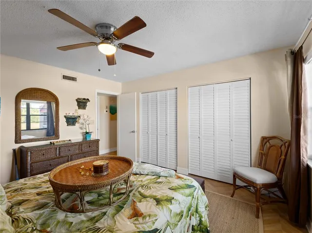 a bathroom with a sink mirror vanity and toilet