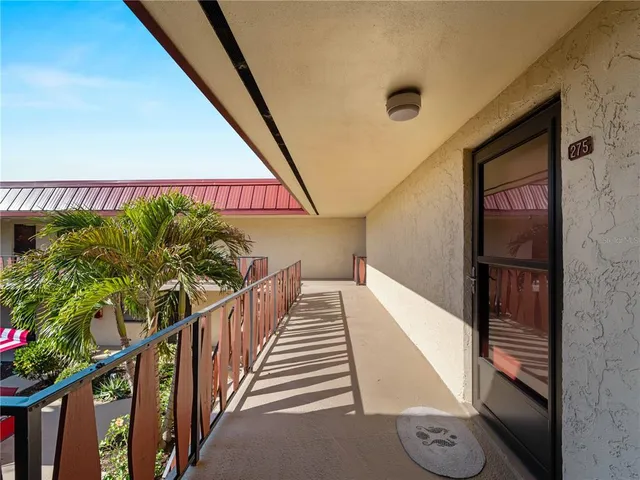 a view of a chairs and table in patio