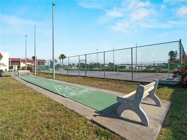 a aerial view of a house with swimming pool outdoor seating and yard
