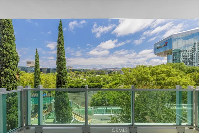 a view of a garden from a balcony