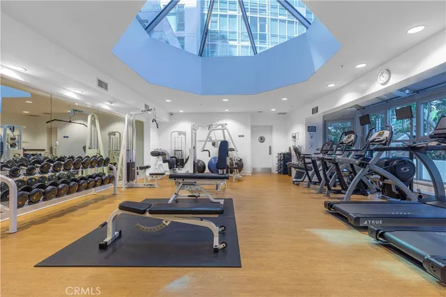 a room with lots of chairs in it and wooden floor