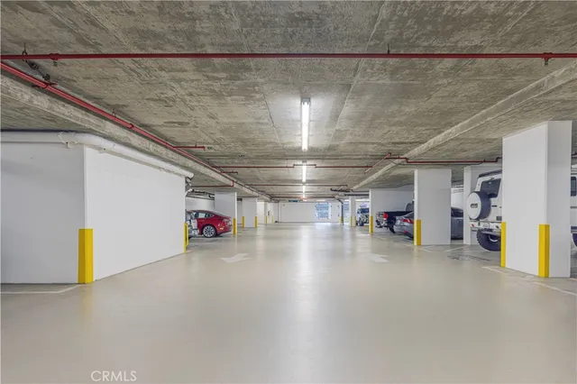 a view of parking area with parked cars