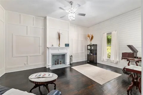 a kitchen with stainless steel appliances granite countertop a stove and a wooden floors