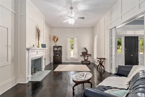 a kitchen with windows and white cabinets