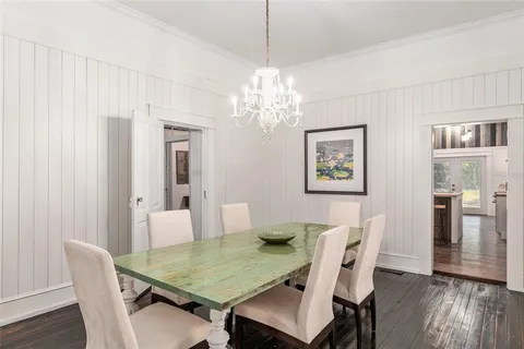 a kitchen with a sink cabinets stainless steel appliances and a window