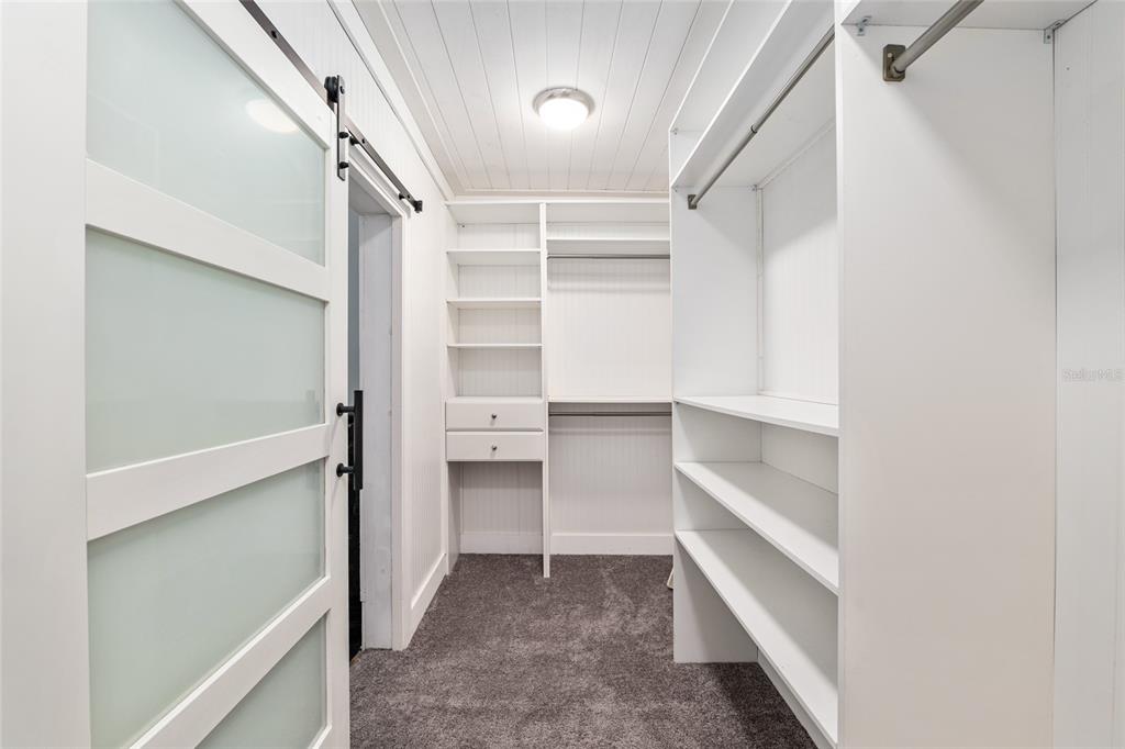 19451 Southeast 2 Street Williston, FL 32696 - Photo 64 of 99 a view of walk in closet with empty racks