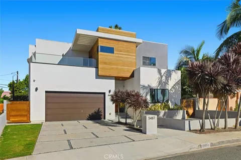 a front view of a house with a garage