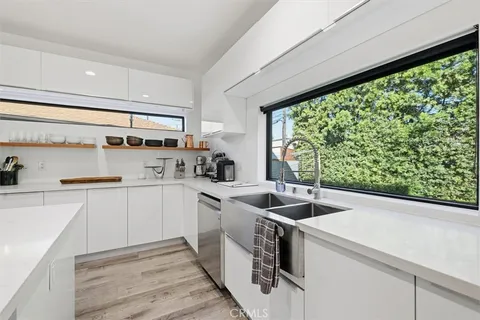 a view of a dining area with furniture window and wooden floor