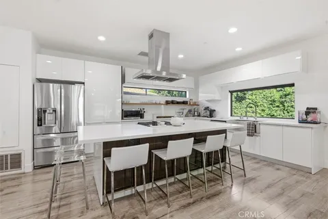 a living room with furniture a rug and a flat screen tv