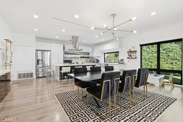 a view of an entryway with wooden floor
