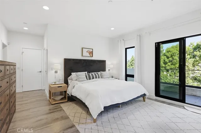a view of walk in closet with clothes