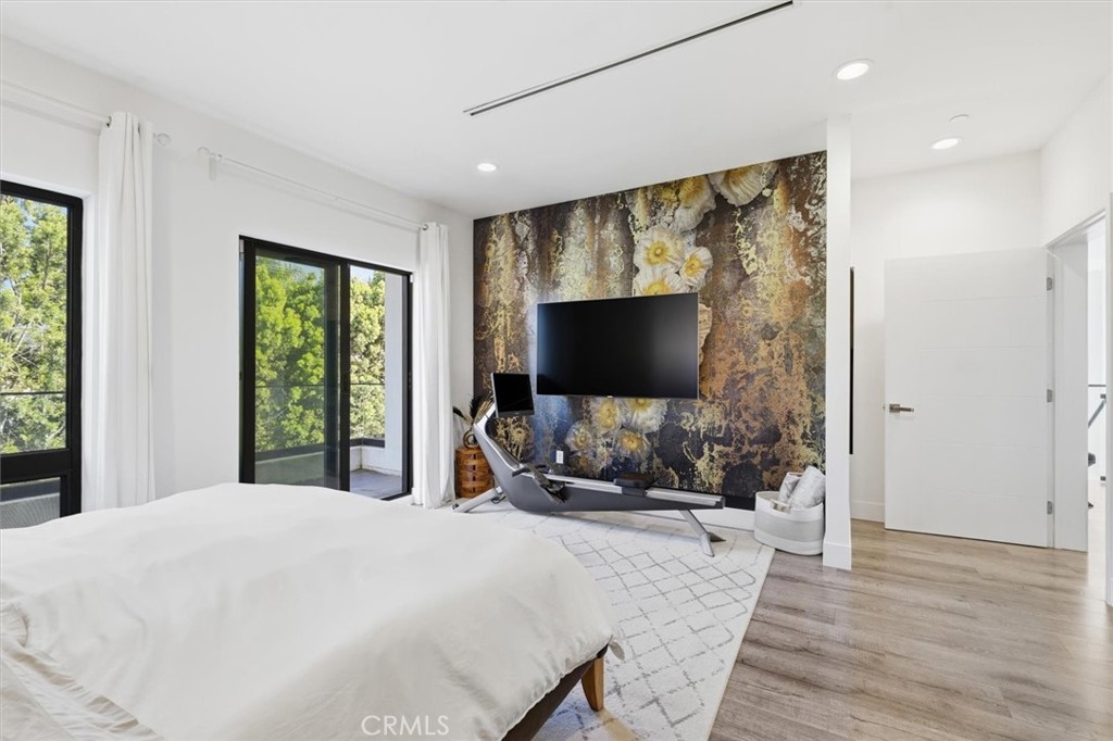 5487 Blanco Way Culver City, CA 90230 - Photo 24 of 58 a bedroom with a bed and a flat screen tv