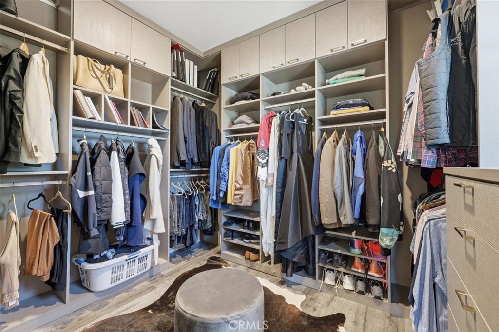 5487 Blanco Way Culver City, CA 90230 - Photo 26 of 58 a view of walk in closet with clothes