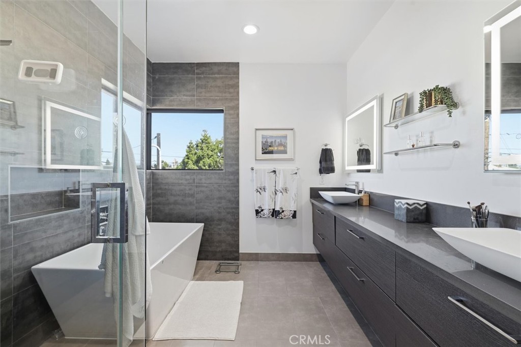 5487 Blanco Way Culver City, CA 90230 - Photo 27 of 58 a large bathroom with a tub sink and mirror