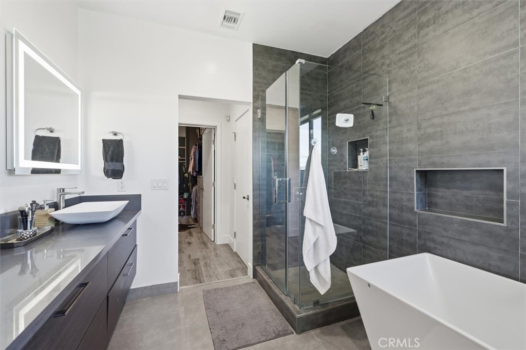 5487 Blanco Way Culver City, CA 90230 - Photo 28 of 58 a bathroom with a sink a toilet and shower