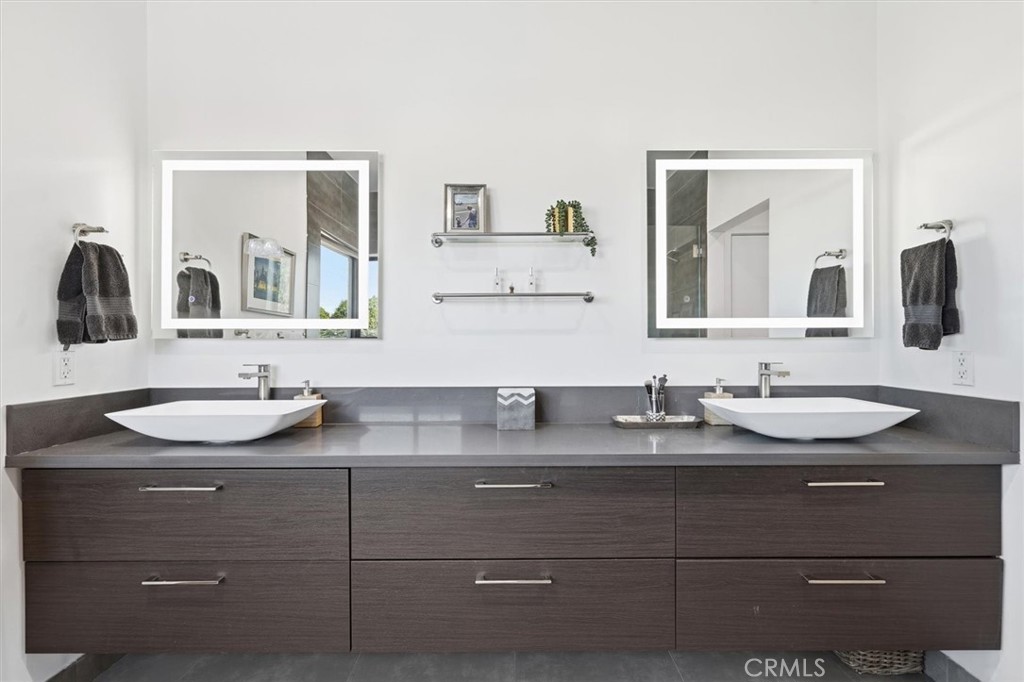 5487 Blanco Way Culver City, CA 90230 - Photo 29 of 58 a bathroom with a granite countertop sink and a mirror