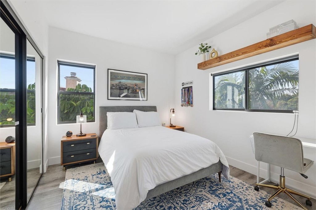 5487 Blanco Way Culver City, CA 90230 - Photo 35 of 58 a bedroom with a bed and wooden floor